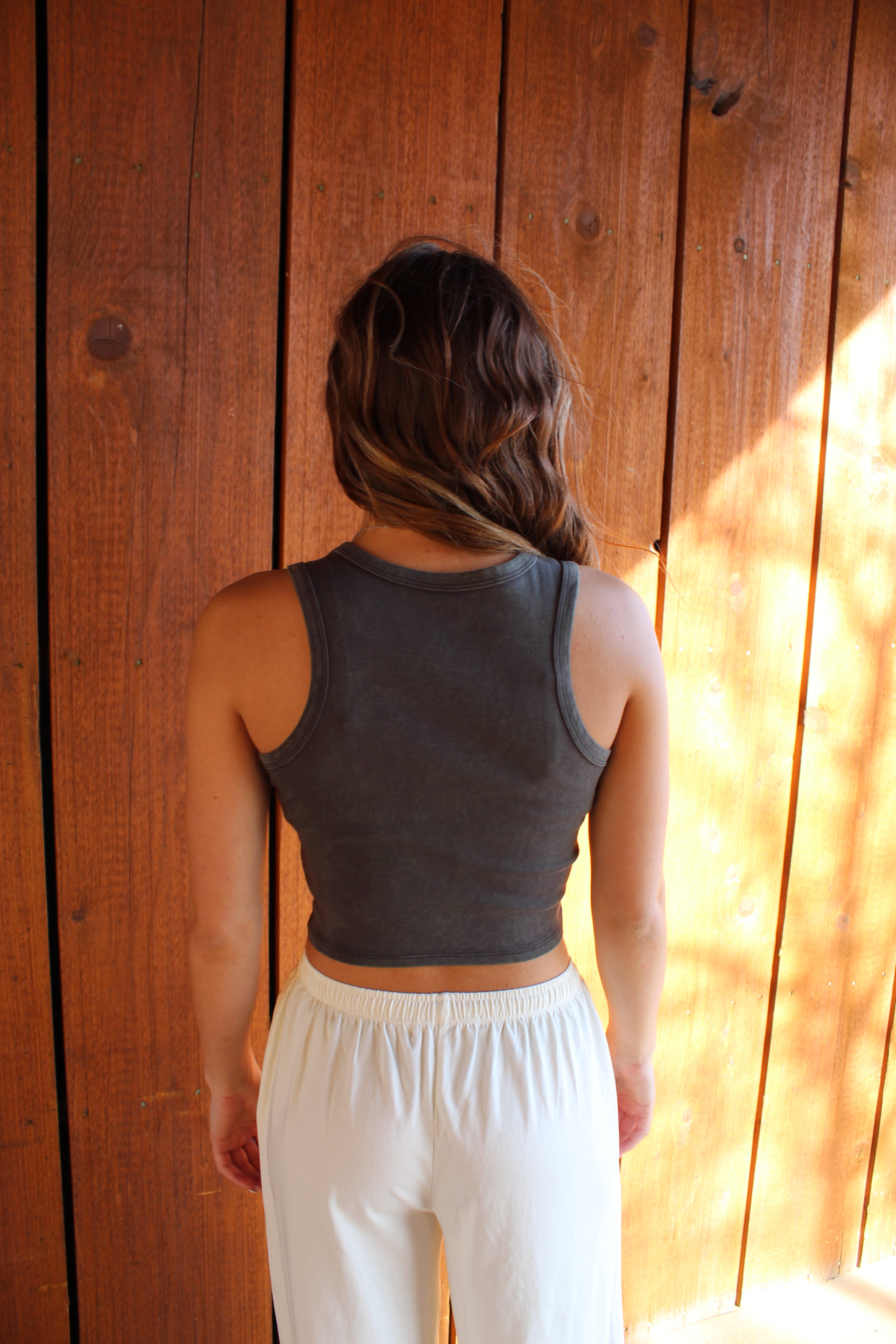 Desert Bloom western graphic crop tank with cow skull design
