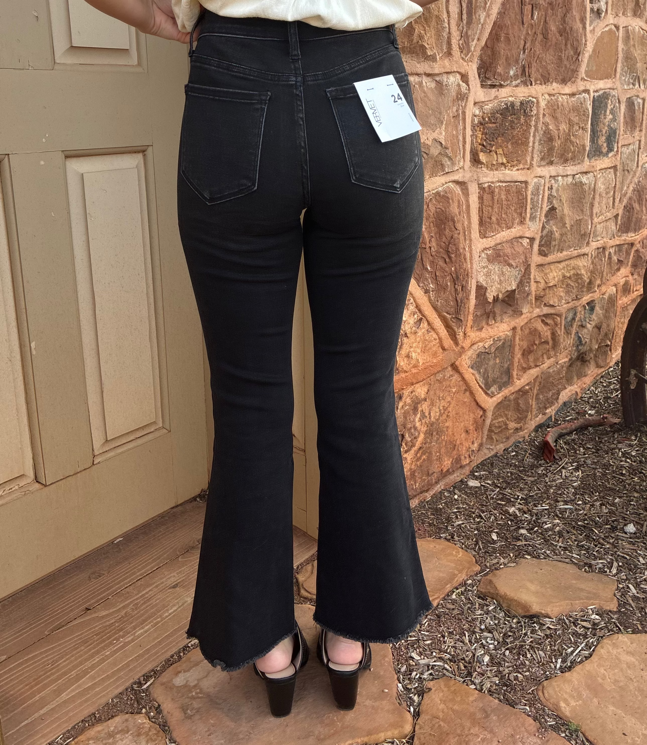 Vervet Alison mid rise black flare jeans with cropped raw hem 