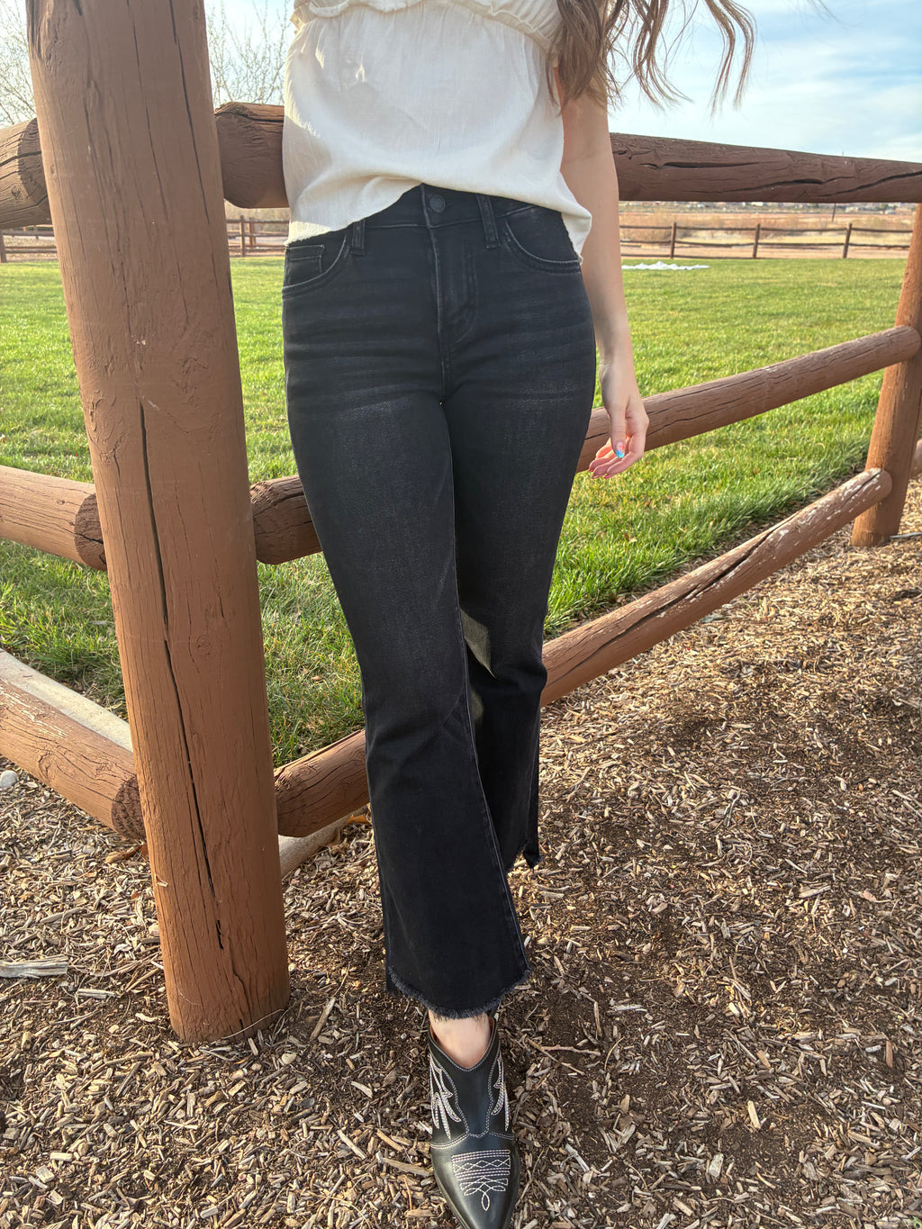 Vervet Alison mid rise black flare jeans with cropped raw hem 