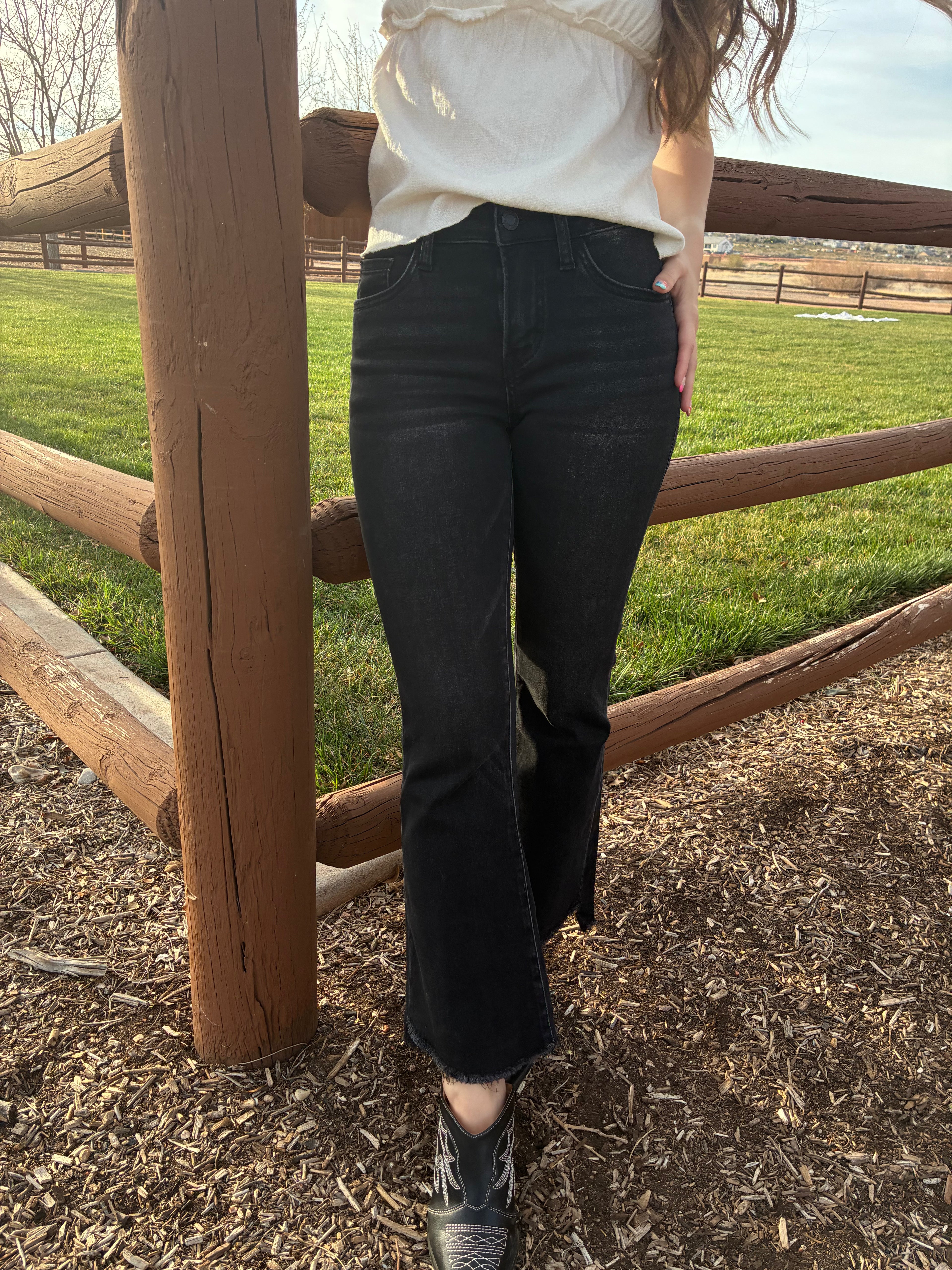 Vervet Alison mid rise black flare jeans with cropped raw hem 