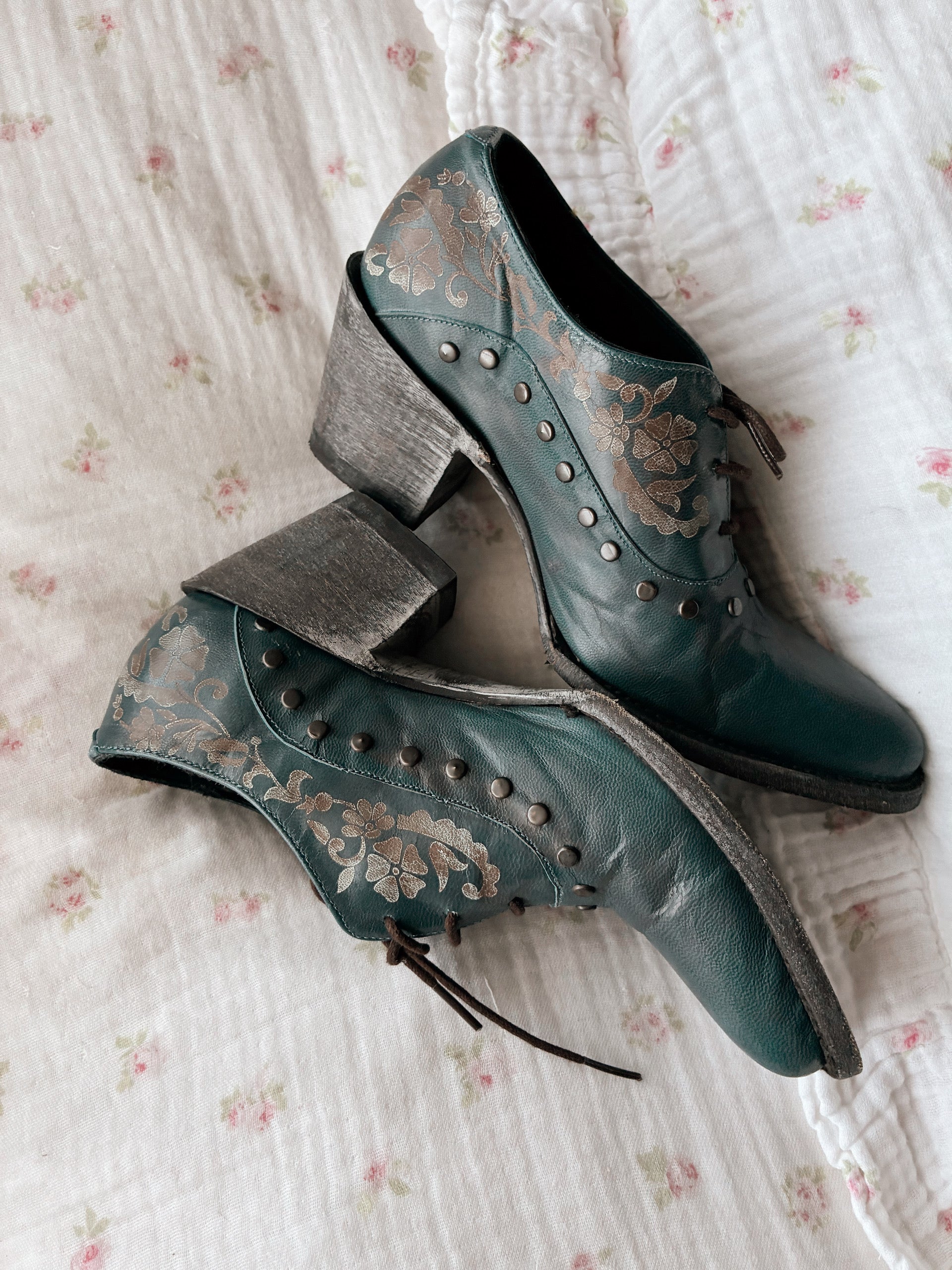 Old Gringo teal embossed leather western booties with studded details and wooden heel styled.