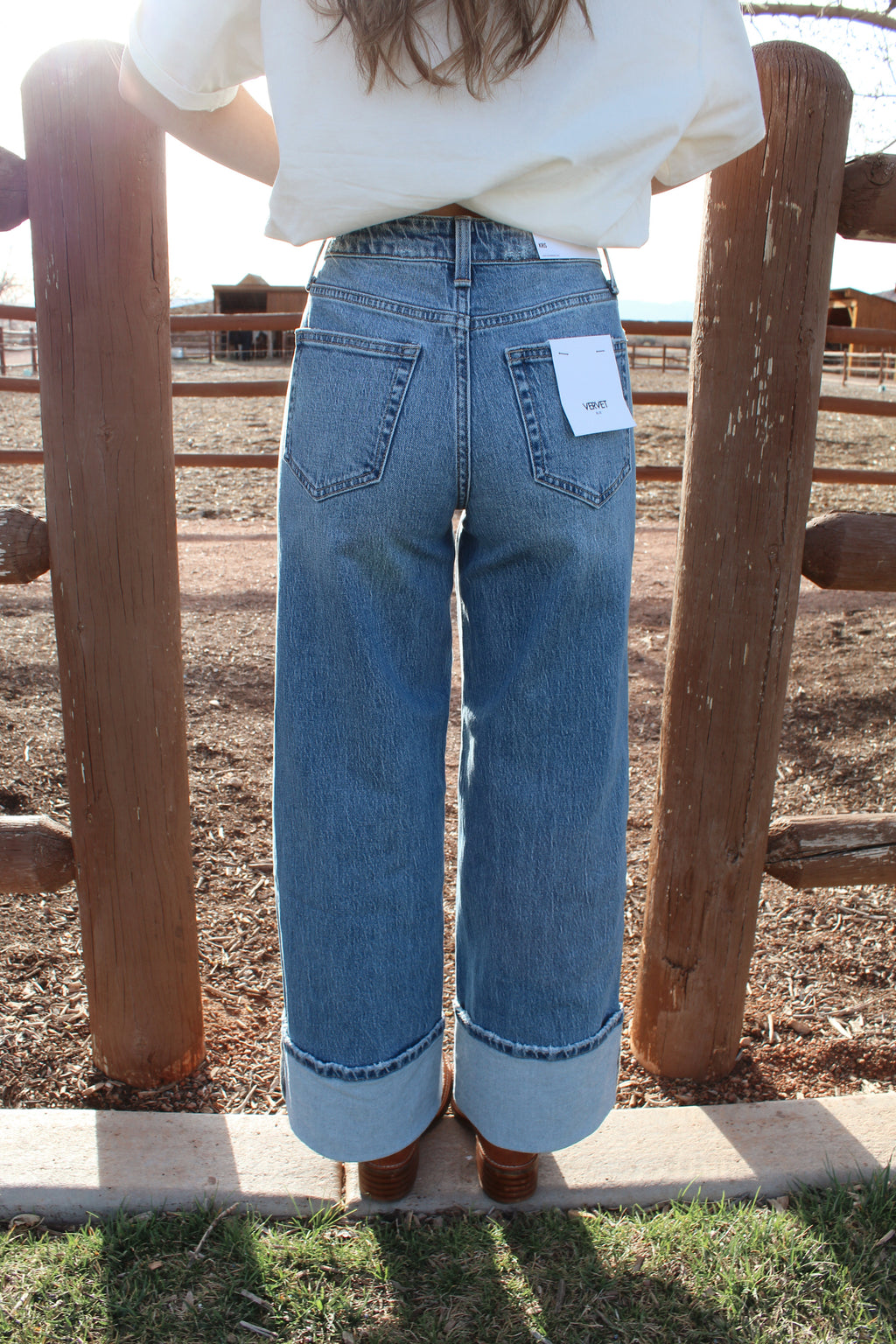 Dark wash mid-rise Kris from vervet baggy wide leg jeans with cuffed hem styled western 