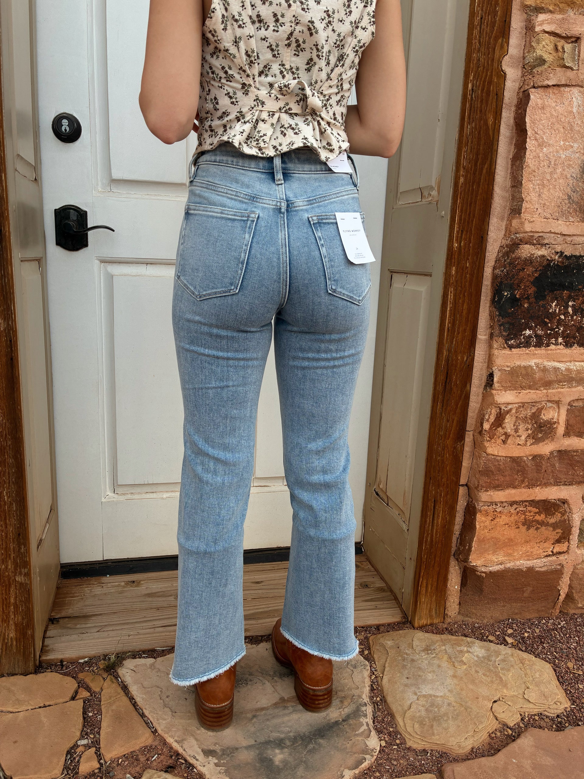 Flying Monkey high rise light wash kick flare jeans with cropped raw hem 