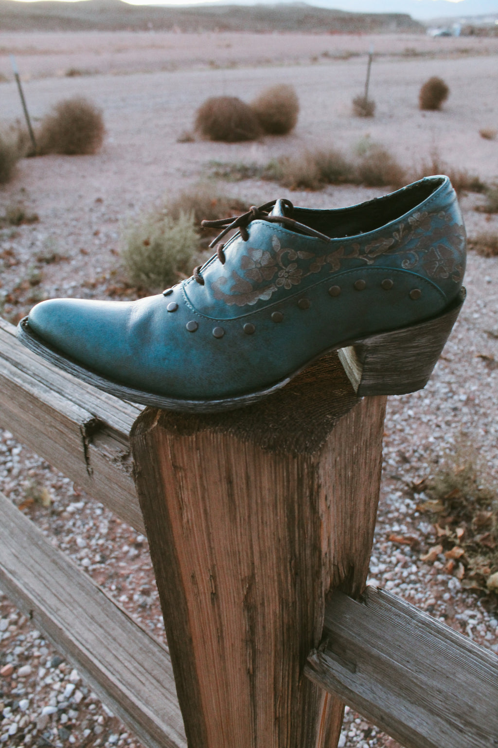 Old Gringo teal embossed leather western booties with studded details and wooden heel styled.